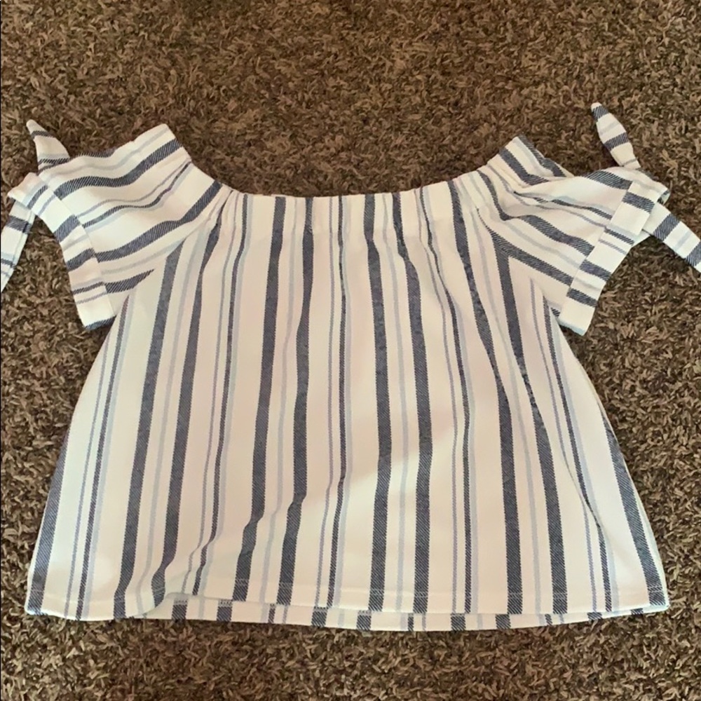 loose fitting shirt that sits on the shoulders